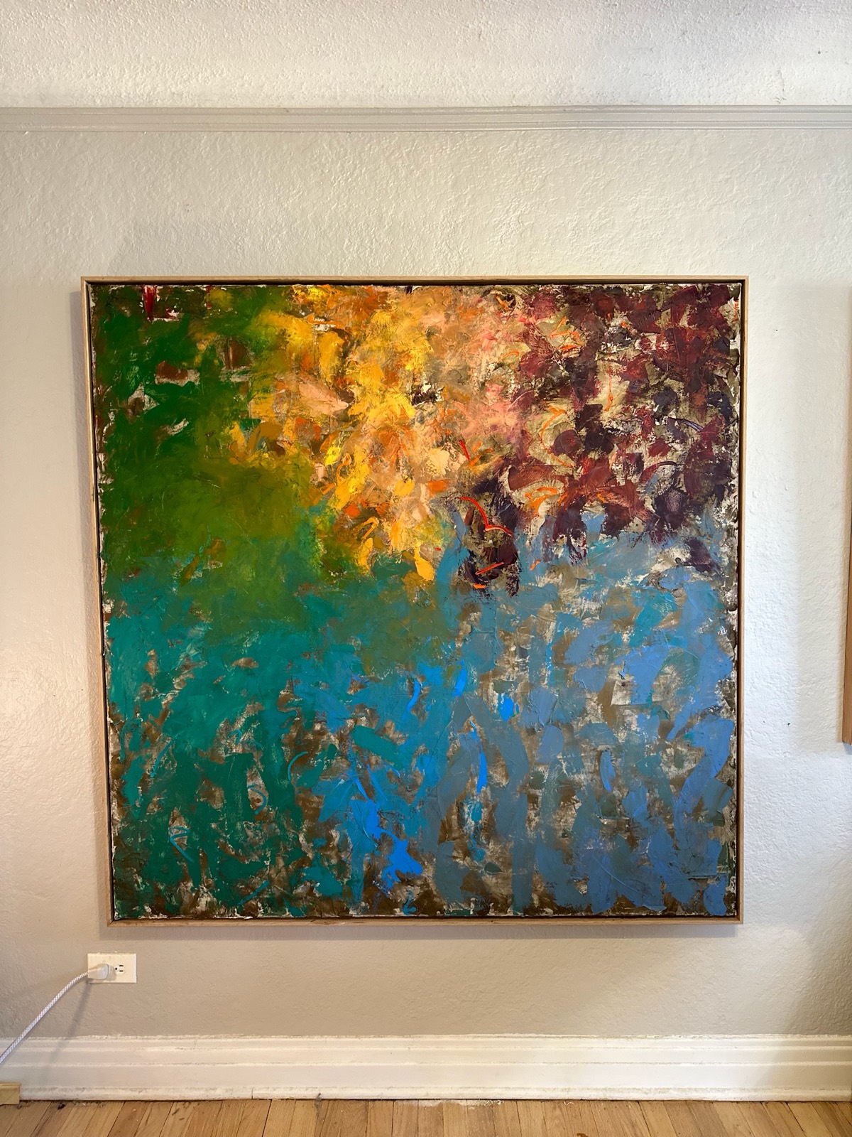 Detail of a large abstract painting in amber, viridian and turquoise by Julie Brayton